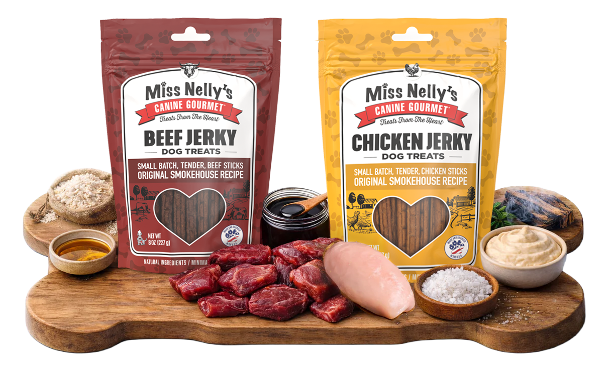Two packages of Miss Nelly's Canine Gourmet dog treats on a wooden board with raw ingredients.