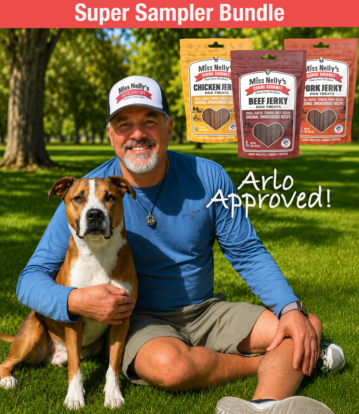 Robert sitting on grass with a Arlo the dog, surrounded by Miss Nelly's pet treats packaging.