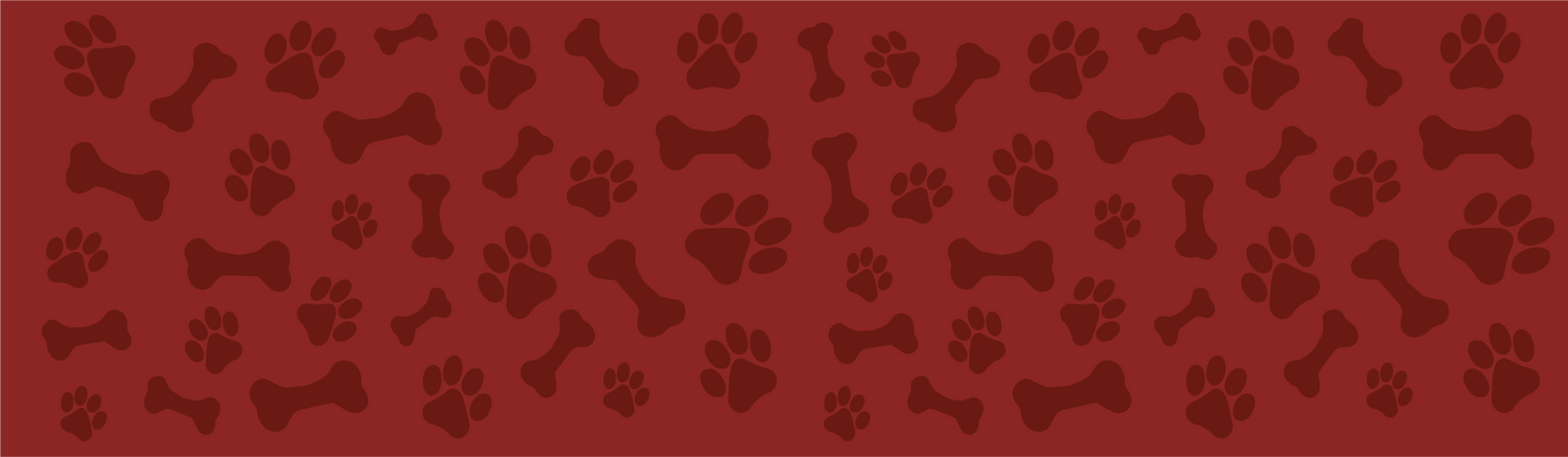 Pattern of dog bones and paw prints on a red background
